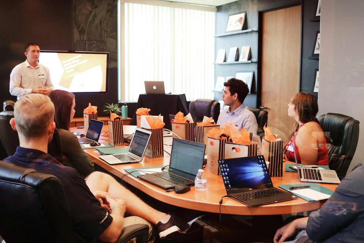 Team presenting a slide deck in a boardroom